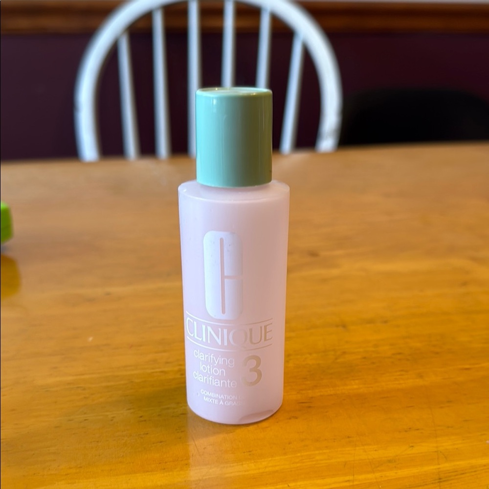 Clinique empty plastic clarifying lotion bottle. Holds 2 ounces.